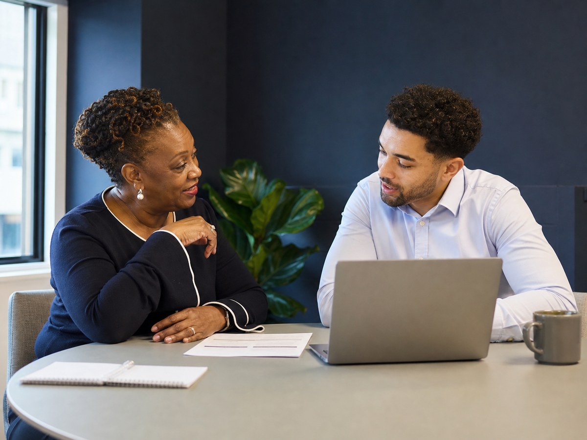 Recruitment consultant and client discussing workforce plans